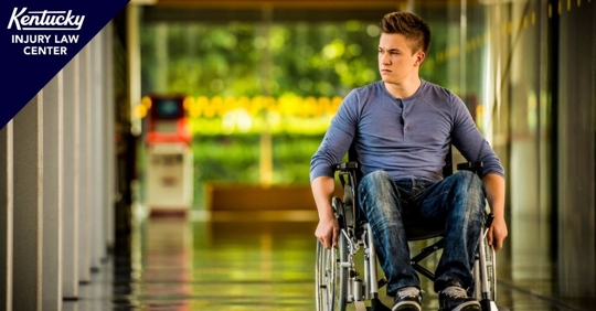 Man in wheelchair in hallway